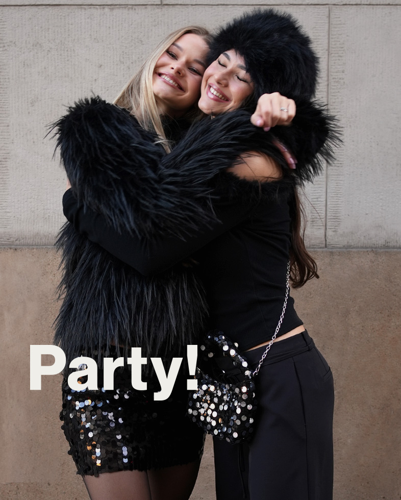 Two people dressed elegantly in party outfits hugging each other. The word "Party!" is written on the image.